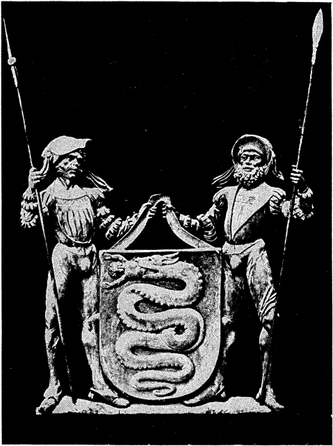 FIG. 484.--Arms of the Visconti, Dukes of Milan: Argent, a serpent azure, devouring a child gules. (A wood-carving from the castle of Passau at the turn of the fifteenth century.)
